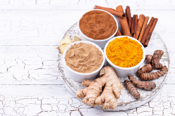 Bowls of ground tuermeric, ginger and cinnamon